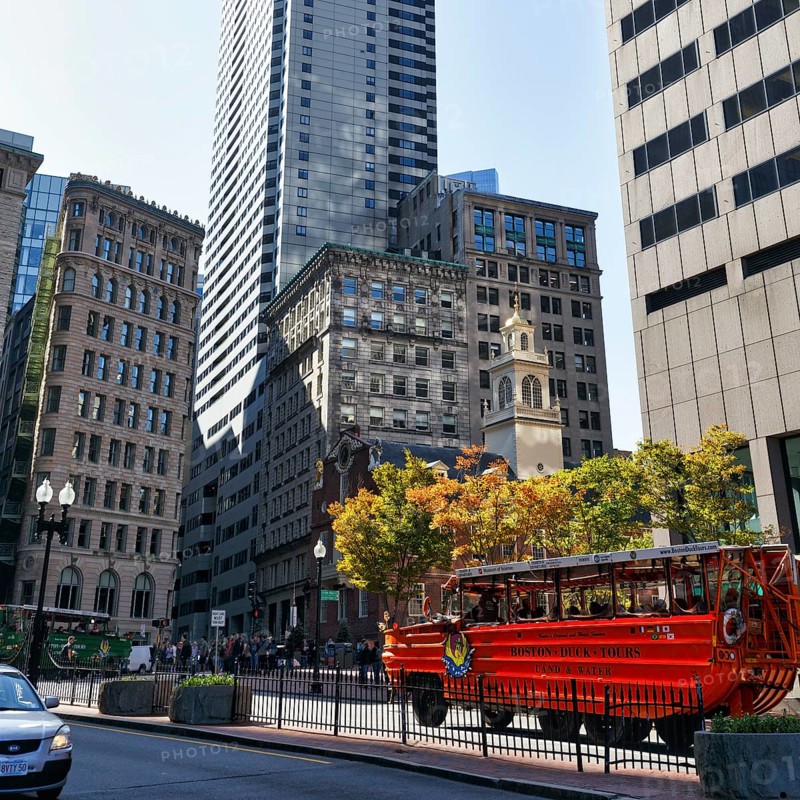 Boston Duck Tour, special city tour in amphibious vehicle from World War II, red bus in front of Old State House, passers-by, Indian Summer, Financial District, Downtown, Boston, Massachusetts, New England, USA