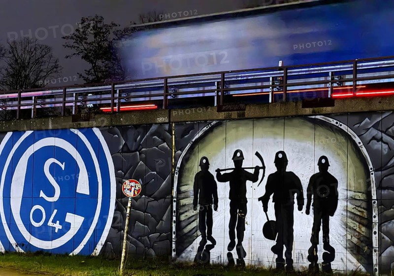 FC Schalke 04 logo and mining motif at the A 42 Gelsenkirchen-Schalke motorway exit at night, North Rhine-Westphalia, Germany