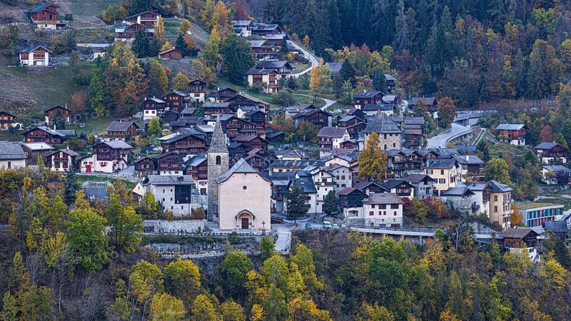 The mountain village of Vissoie with the Sainte Euphemie church at dawn, Val d'Anniviers, Valais Alps, Canton of Valais, Switzerland