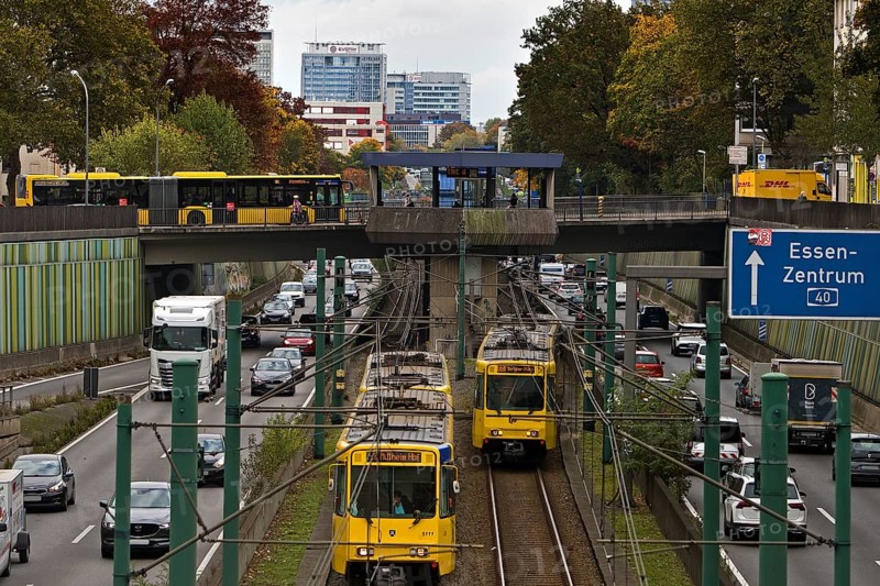 Lots of traffic on the A 40 motorway on four lanes and two subways on two lanes and a bus on the bridge, infrastructure, Essen, Ruhr area, North Rhine-Westphalia, Germany