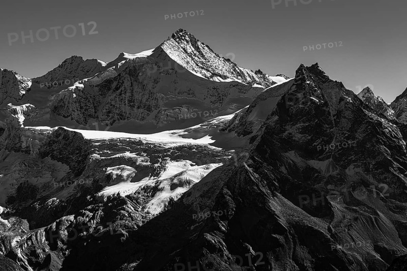 The snow-capped peaks of the Zinalrothorn and Besso mountains, black and white photo, Val d'Anniviers, Valais Alps, Switzerland