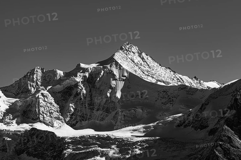 Snowy peak of Zinalrothorn mountain, black and white photo, Val d'Anniviers, Valais Alps, Canton of Valais, Switzerland