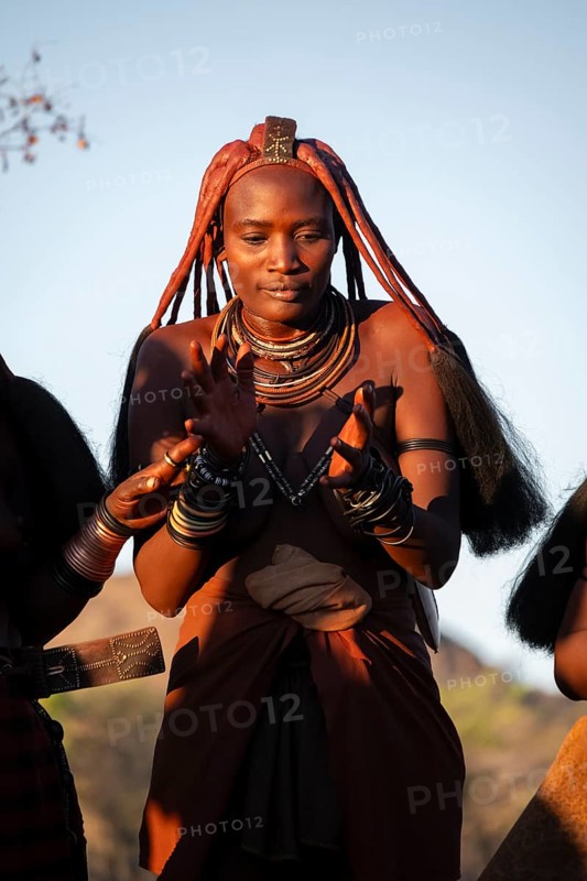 Portrait, Himba woman clapping, traditional clothing, Kaokoveld, Kunene, Namibia