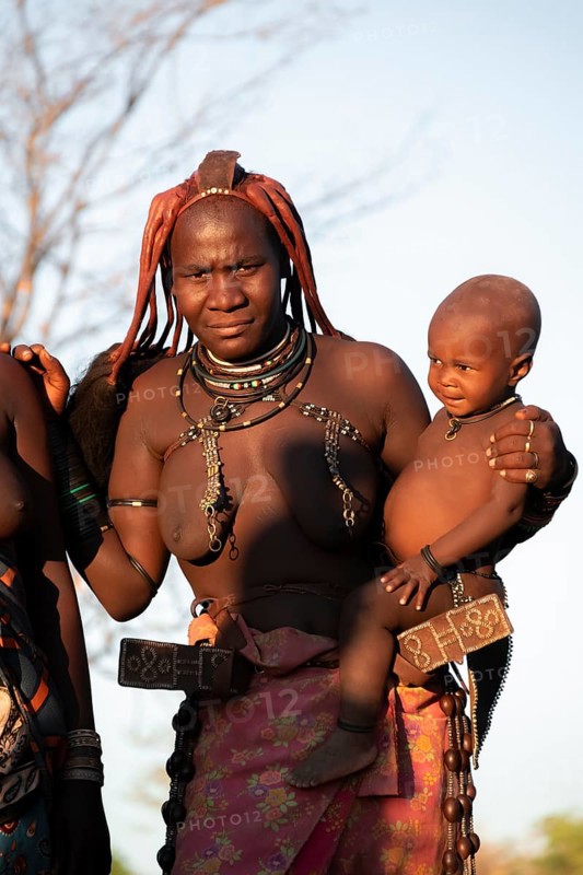 Portrait, Himba woman with baby, traditional clothing, Kaokoveld, Kunene, Namibia