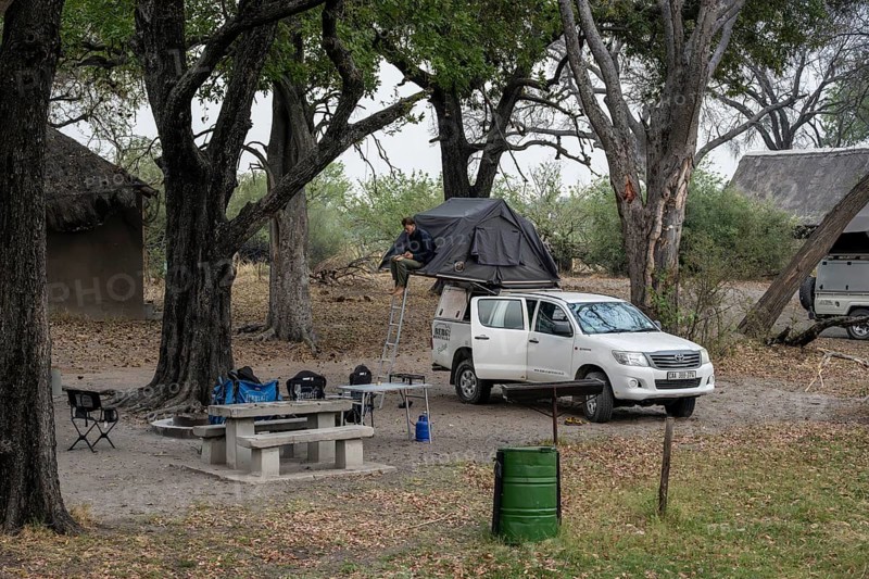 Campground, off-road car with roof tent, Xakanaxa, Moremi Game Reserve, Botswana