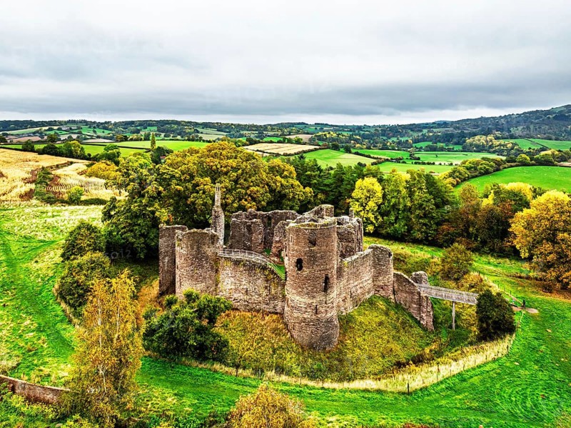 Autumn Colours over ruins of Grosmont Castle from a drone, Grosmont, Monmouthshire, Wales, UK