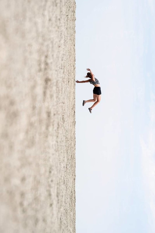Symbolic picture, abstract, woman falling, rotated image on the Etosha pan, salt pan, Etosha National Park, Namibia
