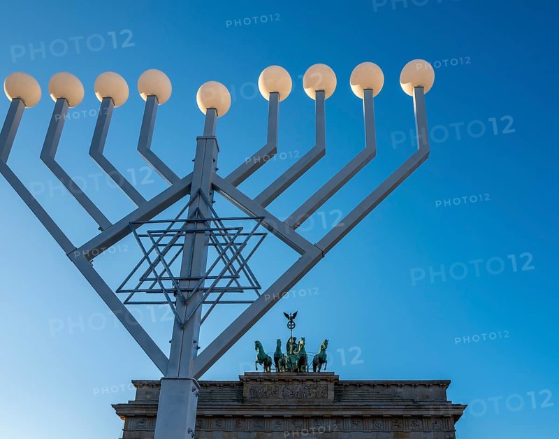 Large Hanukkah chandelier at the Brandenburg Gate in daylight, sign of lively Jewish life, symbolic power for 20 years, Berlin, Germany