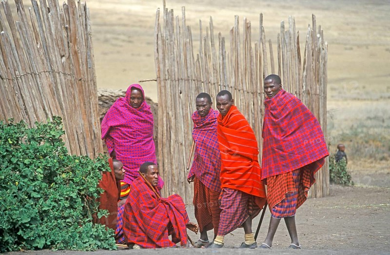 Maasai men in front of their village in Ngorongoro Crater, Tanzania, Africa, June 2000, vintage, retro, old, historic