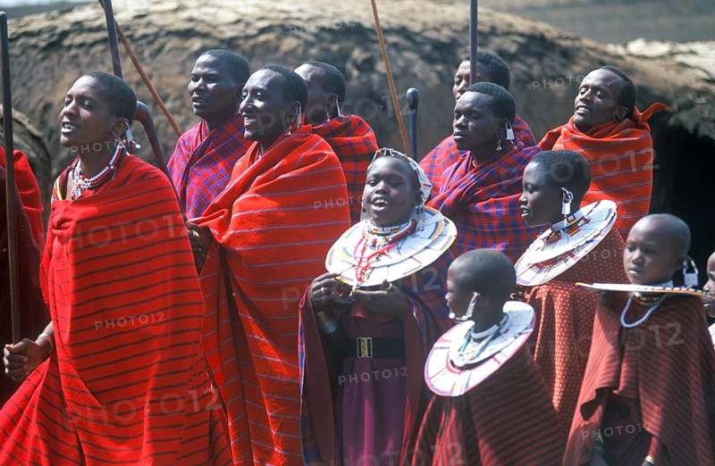 Maasai men and girls in their village in the Ngorongoro Crater dancing for tourists, Tanzania, Africa, June 2000, vintage, retro, old, historic