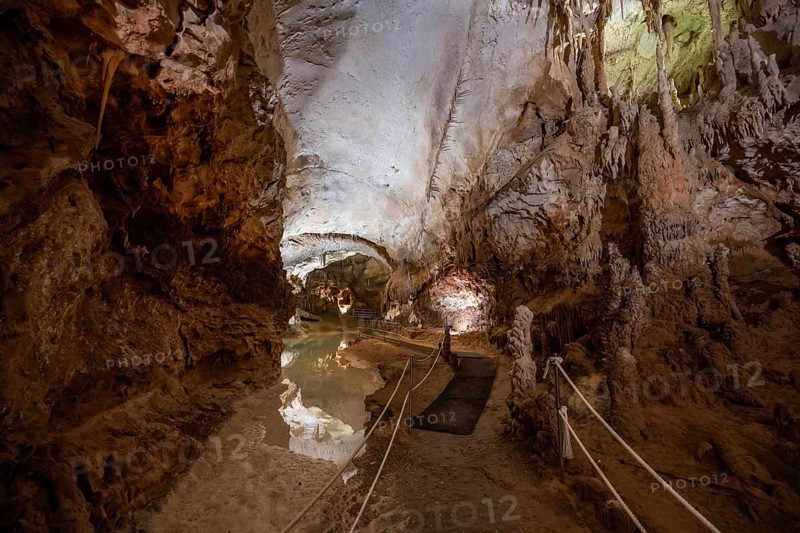 Stalactites and stalagmites, reflection in a small underground lake, rock formations in a stalactite cave, Grotta del Fico, Gulf of Orosei, Baunei, Sardinia, Italy