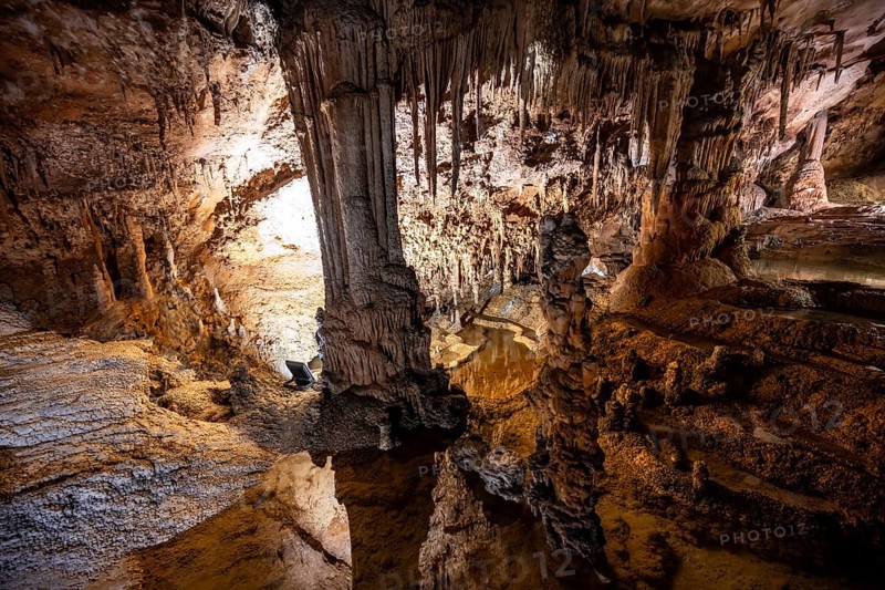 Stalactites and stalagmites, water basins and rock formations in a stalactite cave, Grotta del Fico, Gulf of Orosei, Baunei, Sardinia, Italy