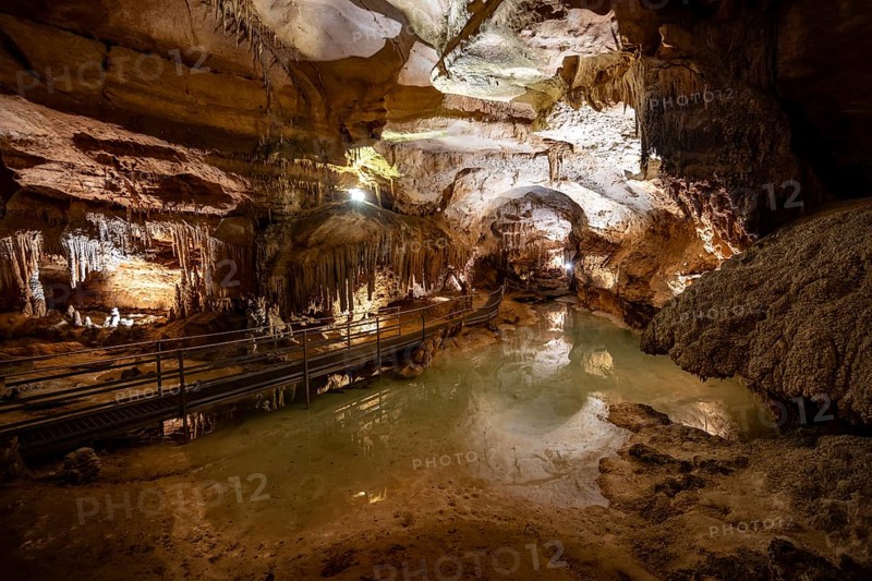 Stalactites and stalagmites, small underground lake and rock formations in a stalactite cave, Grotta del Fico, Gulf of Orosei, Baunei, Sardinia, Italy