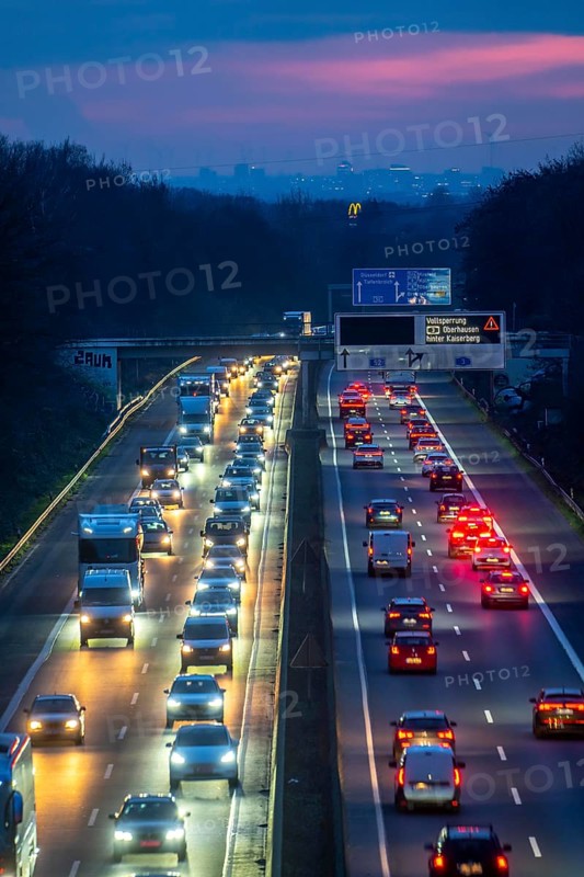 Evening traffic on the A52 motorway, between Düsseldorf and Essen, in front of the Breitscheid motorway junction, partly slow rush hour traffic, looking south, North Rhine-Westphalia, Germany