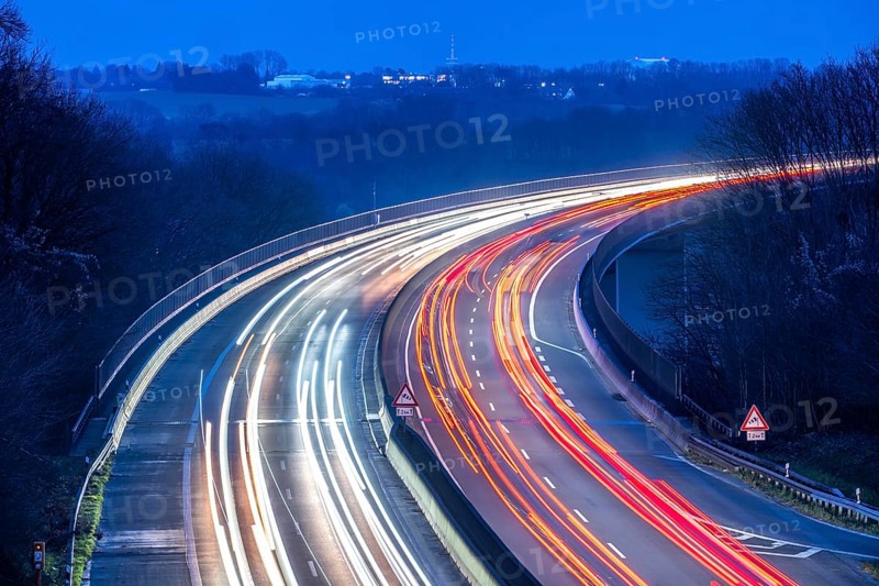 Evening traffic on the A52 motorway, between Düsseldorf and Essen, at the Ruhr Valley Bridge, across the Ruhr near Mülheim-Mintard, partly slow, rush hour traffic, looking north, North Rhine-Westphalia, Germany
