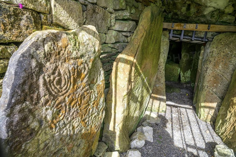 Entrance with decorated wall stone of Loughcrew Cairns a megalithic grave, Stonefield, County Meath, Ireland