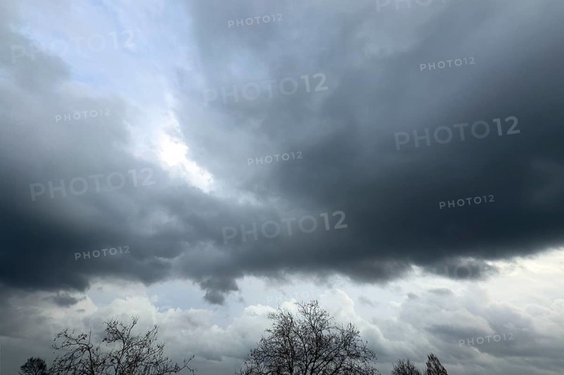 Large grey cloud roller Stratocumulus cluster layer cloud during high winter conditions, international