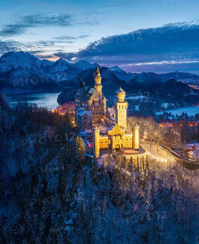 Illuminated Neuschwanstein Castle in winter in evening mood, night view, Schwangau near Füssen, Ostallgäu, Allgäu, Bavaria, Germany