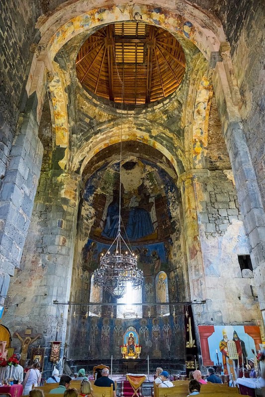 Large church interior with old wall paintings and a richly decorated altar, Akhtala monastery, Akhtala town, Lorikeet province, Armenia