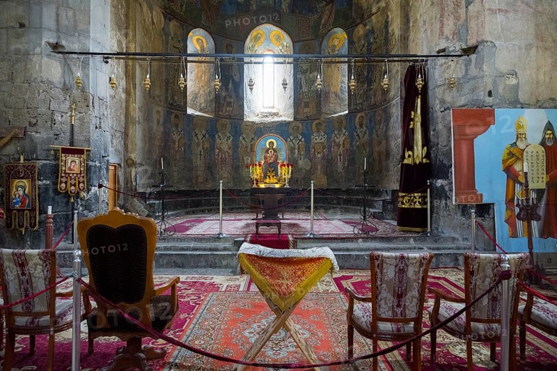 Church room with altar and religious icons decorated with carpets and candles, Akhtala monastery, Akhtala town, Lorikeet province, Armenia