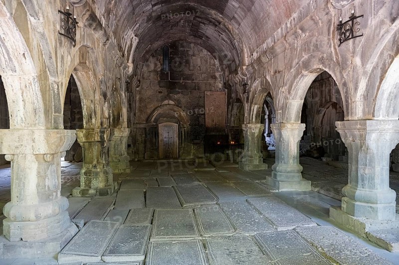 Vaulted room with stone structures and subdued lighting creates a cool atmosphere steeped in history, Sanahin monastery, town of Sanahin, UNESCO World Heritage Site, Lorikeet province, Armenia