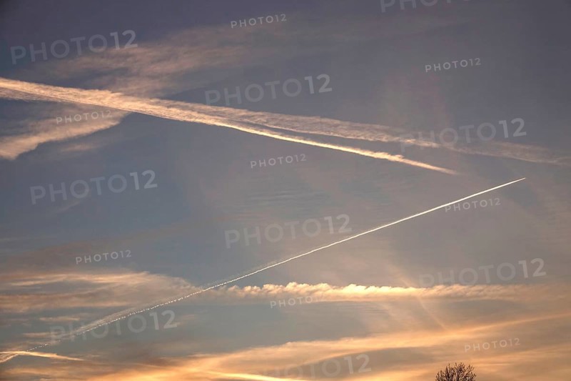 Picturesque evening sky with contrails, autumn, Germany