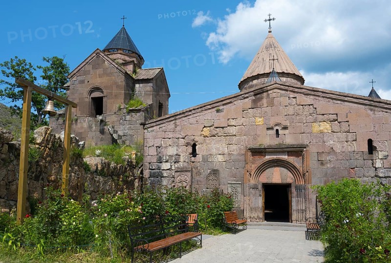 Historic monastery with towers and stone walls, surrounded by garden, Goshavank monastery, Tavush province, Armenia
