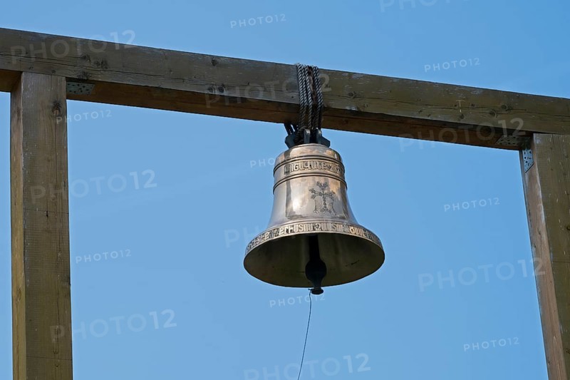 Metal bell on a wooden structure against a clear blue sky, Goshavank monastery, Tavush province, Armenia