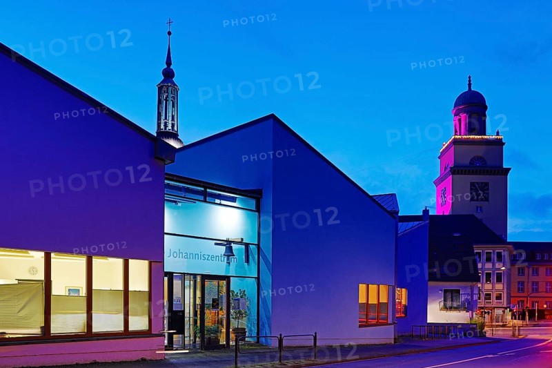 The Johanniszentrum with the top of St. John's Church and the Town Hall Tower in the evening, Witten, Ruhr area, Germany