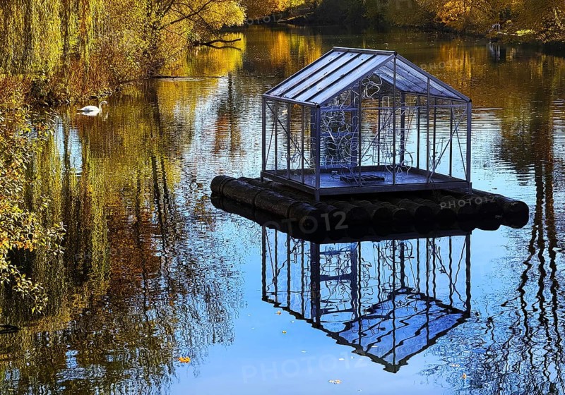 The river Lippe in Grünen Winkel with the artwork Arche by Christoph Hildebrand, Lichtpromenade Lippstadt, North Rhine-Westphalia, Germany