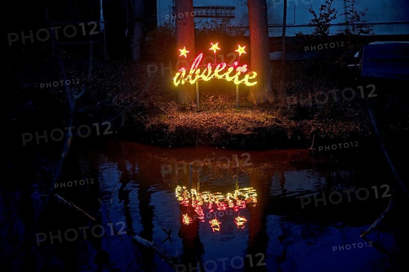 The river Lippe at the Marineverein with the artwork by Jan Philip Scheibe at night, Lichtpromenade Lippstadt, North Rhine-Westphalia, Germany