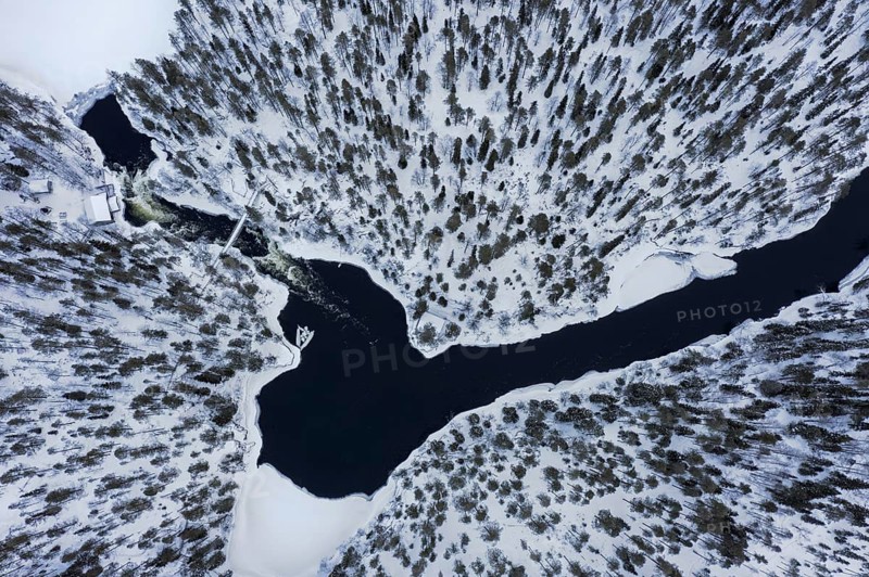 Aerial view over Myllykoski water mill along the river Kitkajoki in winter, Oulanka National Park, Northern Ostrobothnia / Norra Österbotten, Finland