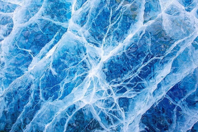 Close-up of blue ice, made of compressed snow, structure showing cracks and fissures inside glacier, Spitsbergen / Svalbard, Norway
