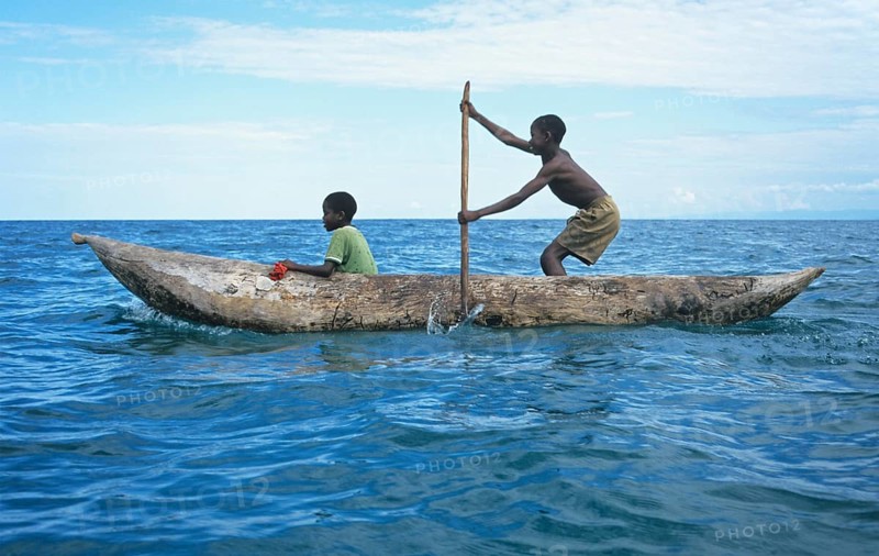 Two boys in a dugout on Lake Malawi, Malawi, Africa, July 2000, vintage, retro, old, historic