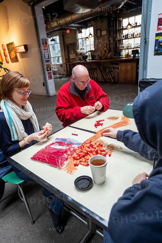 Detroit, Michigan - Volunteers with the Detroit Peoples Assembly put together whistle kits. The whistles are designed to alert others in the community when immigration agents are nearby