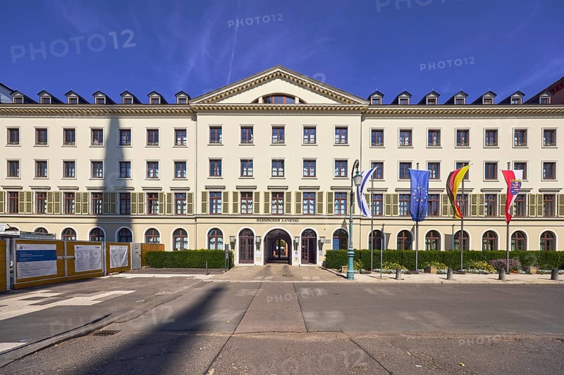 Hessian state parliament, former court marshal office, architectural style classicism, flagpoles, flags, Israeli flag, German flag, European flag, flag of Hesse, entrance area, façade with windows and shutters, dormers, entrance door, blue sky, cirrus clouds, Schlossplatz square, Wiesbaden, state capital, district-free city, Hesse, Germany