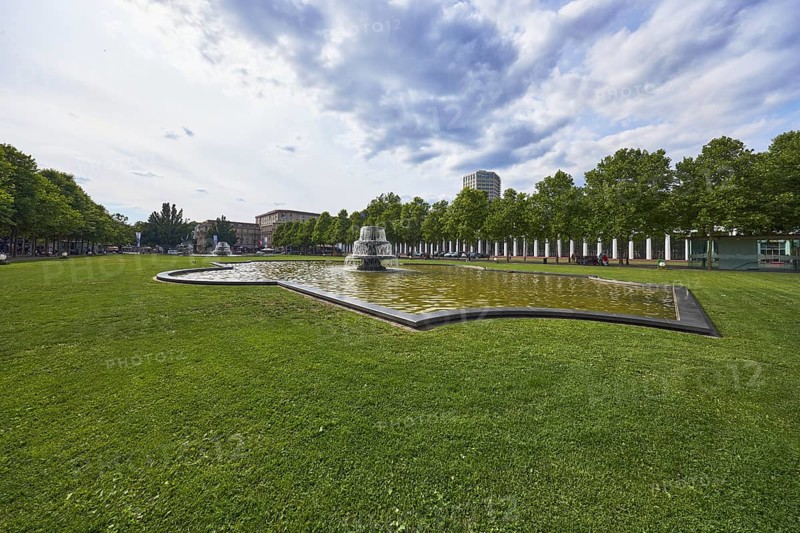 Green area, cascade fountain, bowling green, lawn, trees, back light, side light, cloudy, nimbostratus clouds, cumulus clouds, Kurhausplatz, Wiesbaden, state capital, district-free city, Hesse, Germany