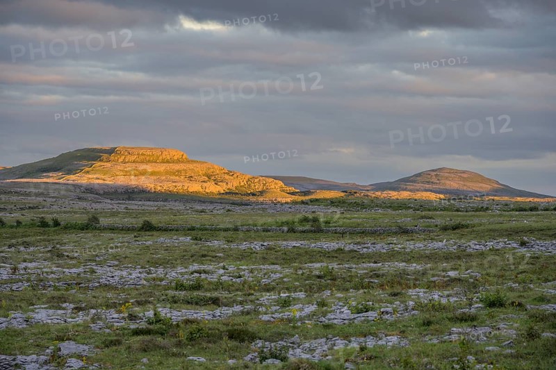 Sunset over the karst landscape of the Burren, Keelhilla, Carran, County Clare, Ireland