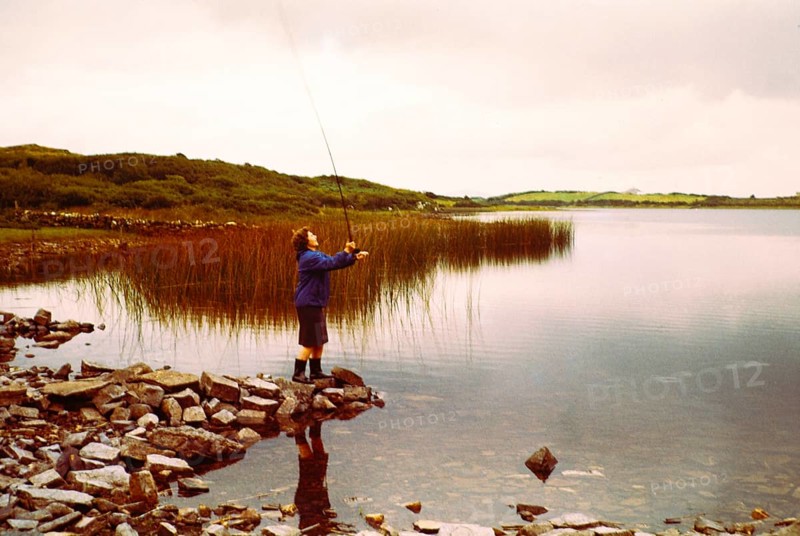 Woman fly fishing on Lough Sessiagh Lake, Portnablagh, County Donegal, Ireland 1960s