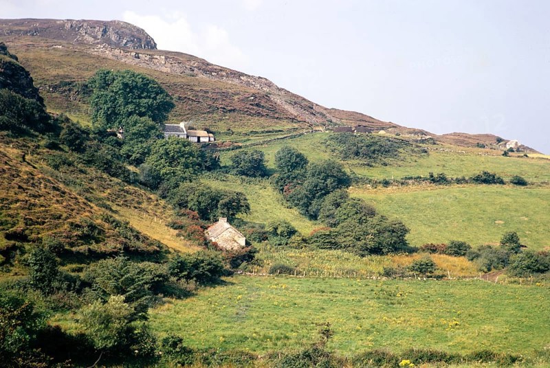 Traditional crofting farming landscape, croft farmhouses in small fields on hillside, County Donegal, Ireland 1971