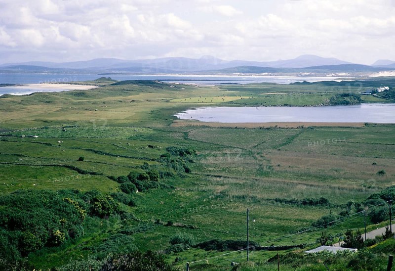 Coastal landscape over Clooney Lake from village of Portnoo, Narin beach, County Donegal, Ireland 1969