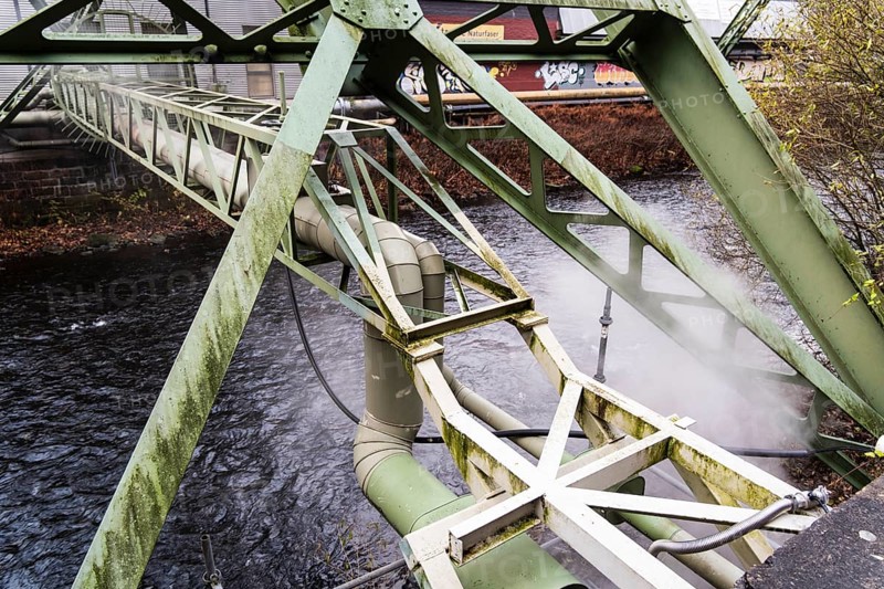 District heating pipeline over the Wupper river, steam escapes, Wuppertal, Germany