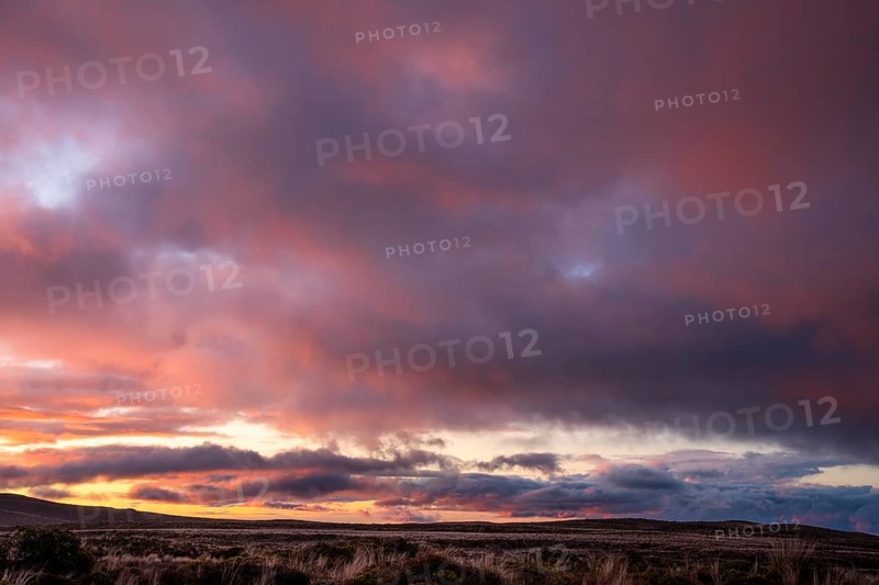 Cloudy sky at sunset, Tama Lake Walk (Tama Lakes Track) . Tongariro National Park, North Island, New Zealand