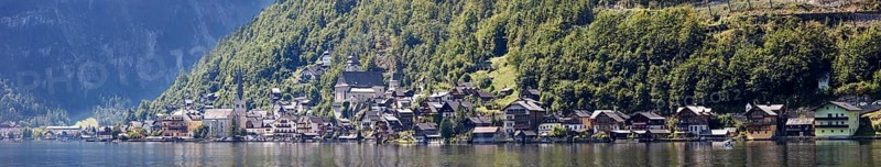 A, Hallstatt, Pano, k, cut, A wide panorama of a picturesque village on a quiet lakeside with wooded mountains, Austria