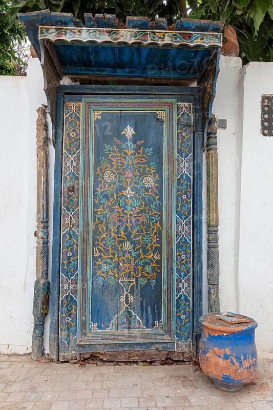 Elaborately decorated blue door with oriental patterns, the oldest door in the Kasbah of Oudaia in Rabat, Morocco