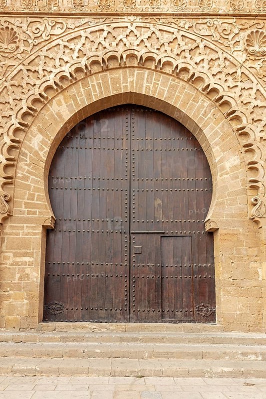 Large gate with finely detailed sandstone engravings