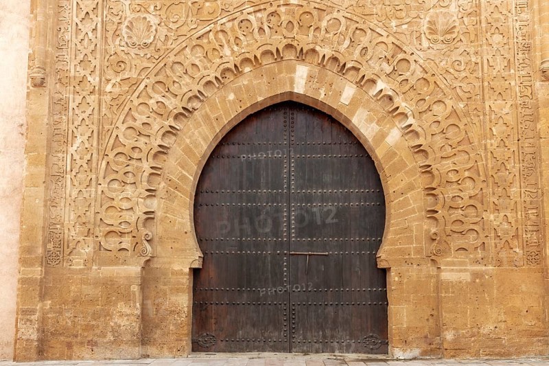 Large door with detailed arabesque decorations