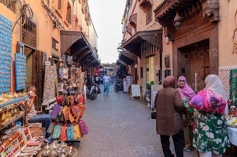 Lively market alleyway with lots of shops and souvenirs in a narrow alley