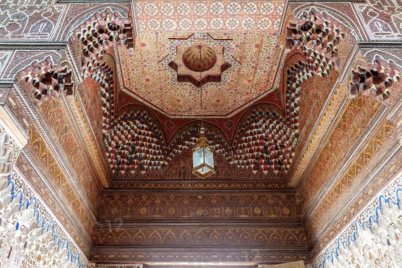 Magnificent, detailed vaulted ceiling full of geometric patterns and wooden elements, Bahia Palace in Marrakech, Morocco
