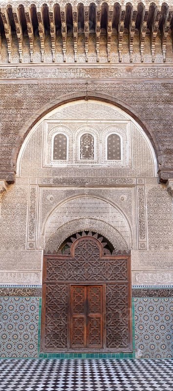 Impressive gate with rich decorations and mosaics in traditional architecture